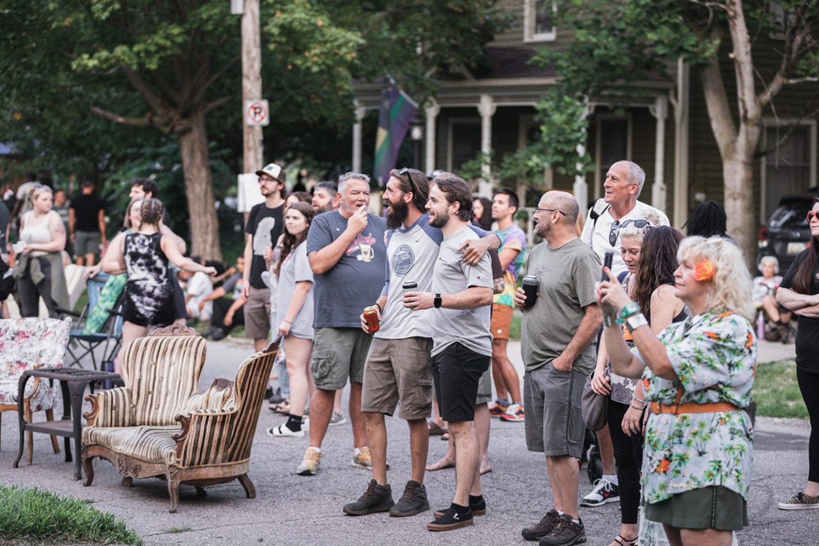 Community members gathered on a Carriage Town street during Porch Fest in Flint, MI.